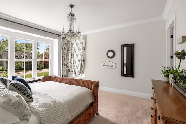 bedroom with carpet floors, baseboards, and a notable chandelier