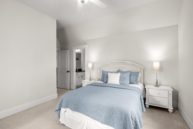 bedroom featuring baseboards, ceiling fan, light carpet, and ensuite bathroom