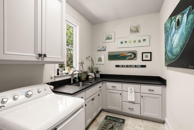 laundry room with washer / clothes dryer, a sink, and cabinet space