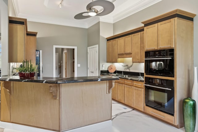 kitchen with dark countertops, a breakfast bar area, dobule oven black, a ceiling fan, and a peninsula