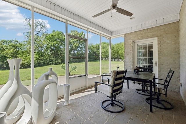 sunroom with a ceiling fan