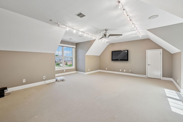 bonus room with visible vents, light carpet, baseboards, ceiling fan, and vaulted ceiling