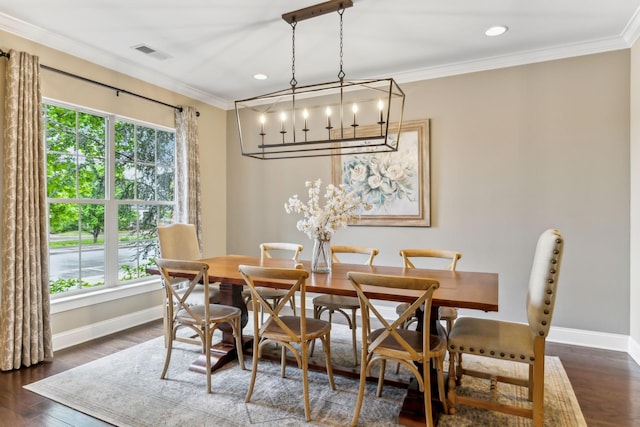 dining space with crown molding, baseboards, and plenty of natural light