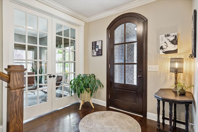 doorway to outside with baseboards, ornamental molding, hardwood / wood-style flooring, and french doors