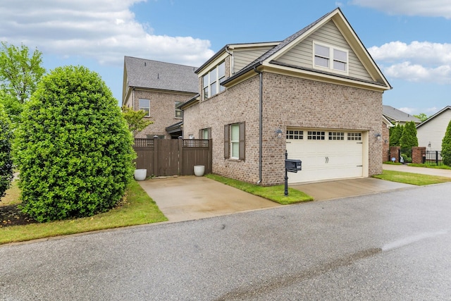 view of property exterior with brick siding, a garage, fence, and concrete driveway