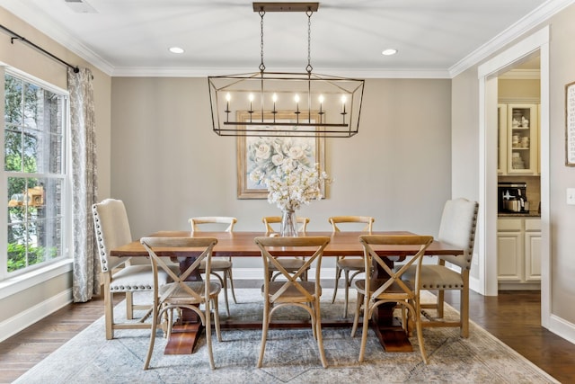 dining room with a notable chandelier, a wealth of natural light, and dark wood-type flooring