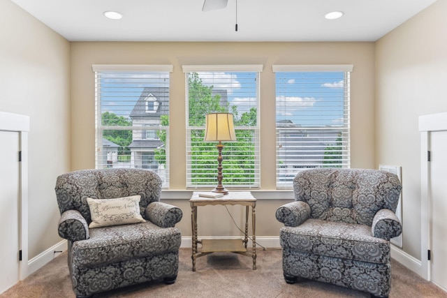 sitting room with a healthy amount of sunlight, carpet floors, and ceiling fan