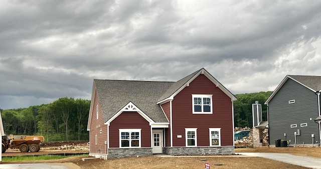 craftsman inspired home featuring stone siding