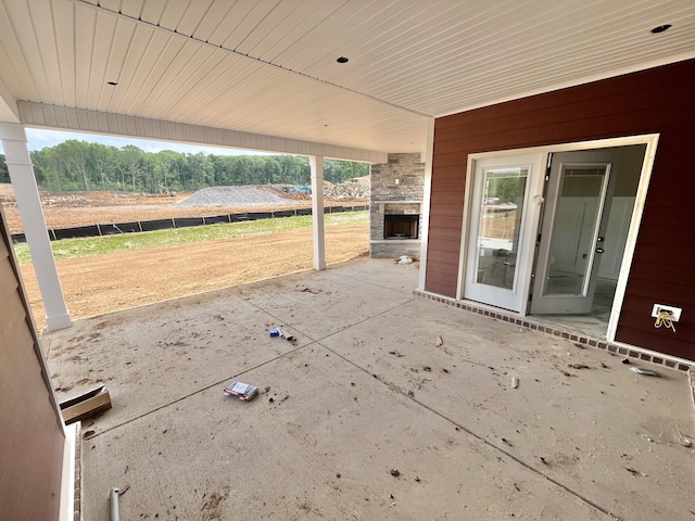 view of patio / terrace with an outdoor stone fireplace