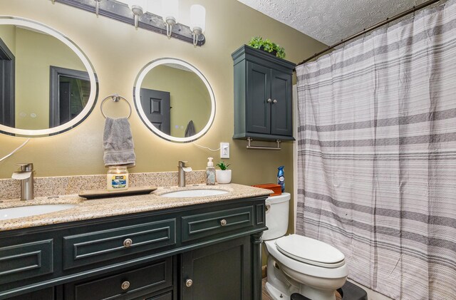 1904 Portway Rd, Spring Hill, TN 37174 - full bathroom featuring toilet, double vanity, and a textured ceiling