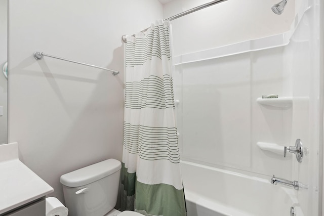 full bathroom with vanity, toilet, and shower / tub combo