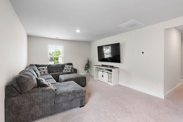 carpeted living room with baseboards and visible vents