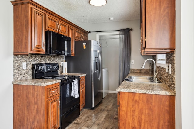 817 Stableford Rd, Oak Grove, KY 42262 - kitchen with dark wood-style flooring, a sink, black appliances, and tasteful backsplash