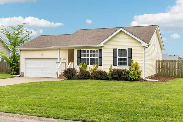 817 Stableford Rd, Oak Grove, KY 42262 - ranch-style house featuring roof with shingles, a front yard, fence, concrete driveway, and an attached garage