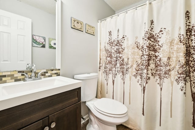 817 Stableford Rd, Oak Grove, KY 42262 - full bath with toilet, tasteful backsplash, curtained shower, and vanity