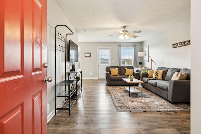 817 Stableford Rd, Oak Grove, KY 42262 - living area with dark wood-type flooring, a textured ceiling, ceiling fan, and baseboards