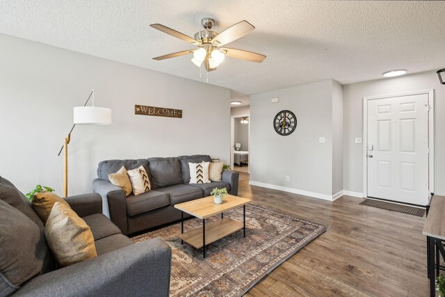 817 Stableford Rd, Oak Grove, KY 42262 - living area featuring baseboards, a textured ceiling, ceiling fan, and wood finished floors