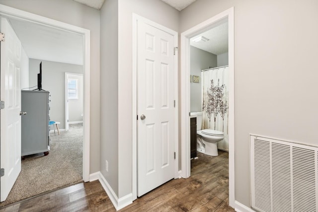 817 Stableford Rd, Oak Grove, KY 42262 - full bathroom with visible vents, baseboards, wood finished floors, and toilet