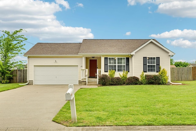 817 Stableford Rd, Oak Grove, KY 42262 - ranch-style house with concrete driveway, an attached garage, fence, and a front lawn