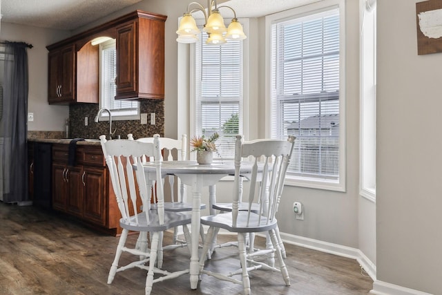 817 Stableford Rd, Oak Grove, KY 42262 - dining space with baseboards, an inviting chandelier, and wood finished floors