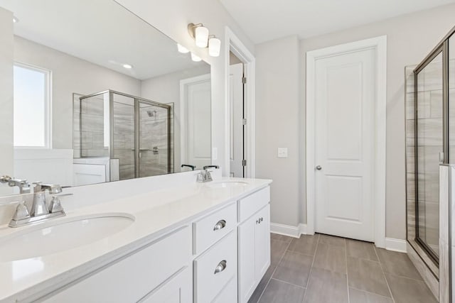 7205 Lake Rd, Fairview, TN 37062 - full bath with a stall shower, baseboards, and double vanity