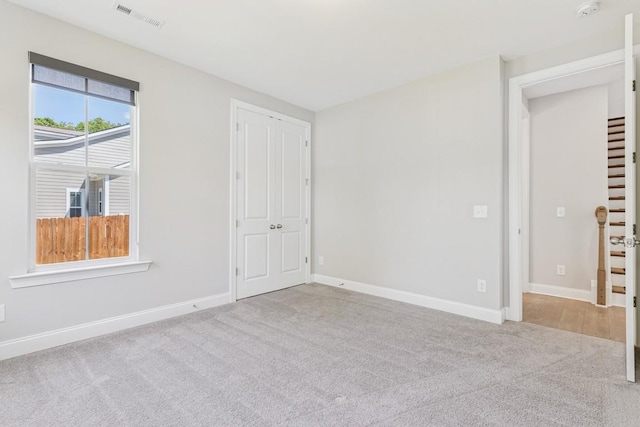 7205 Lake Rd, Fairview, TN 37062 - unfurnished bedroom featuring carpet, baseboards, and a closet