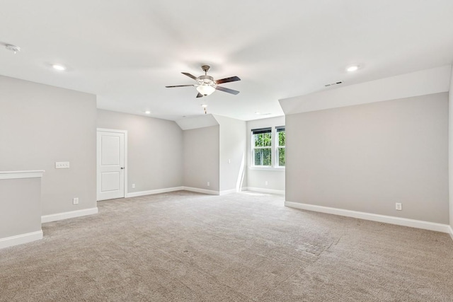7205 Lake Rd, Fairview, TN 37062 - empty room with ceiling fan, light carpet, recessed lighting, baseboards, and vaulted ceiling
