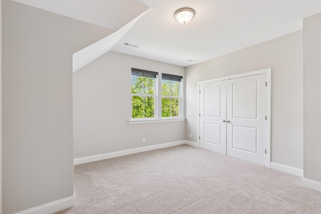 7205 Lake Rd, Fairview, TN 37062 - unfurnished bedroom featuring carpet, baseboards, lofted ceiling, and a closet