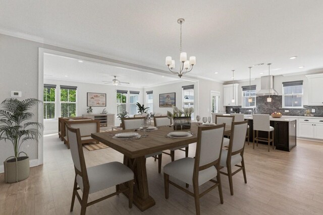 7205 Lake Rd, Fairview, TN 37062 - dining space with light wood-type flooring, a chandelier, ornamental molding, recessed lighting, and a ceiling fan