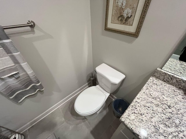 half bathroom featuring toilet