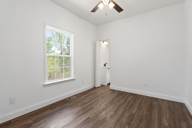 795 Lowery Ln, Mcminnville, TN 37110 - unfurnished room with baseboards, a ceiling fan, dark wood finished floors, and visible vents