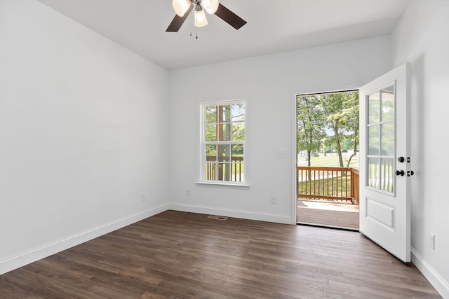 795 Lowery Ln, Mcminnville, TN 37110 - unfurnished room featuring visible vents, a ceiling fan, dark wood finished floors, and baseboards