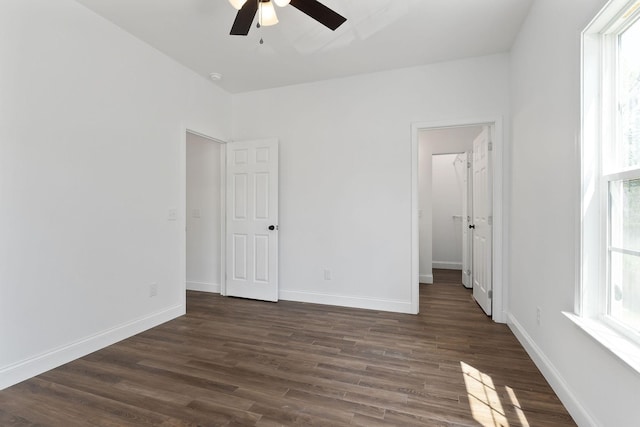 795 Lowery Ln, Mcminnville, TN 37110 - unfurnished bedroom with dark wood-type flooring, baseboards, ceiling fan, and a spacious closet
