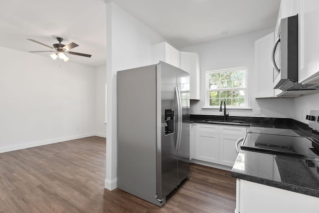 795 Lowery Ln, Mcminnville, TN 37110 - kitchen with a ceiling fan, dark wood finished floors, a sink, white cabinets, and stainless steel appliances