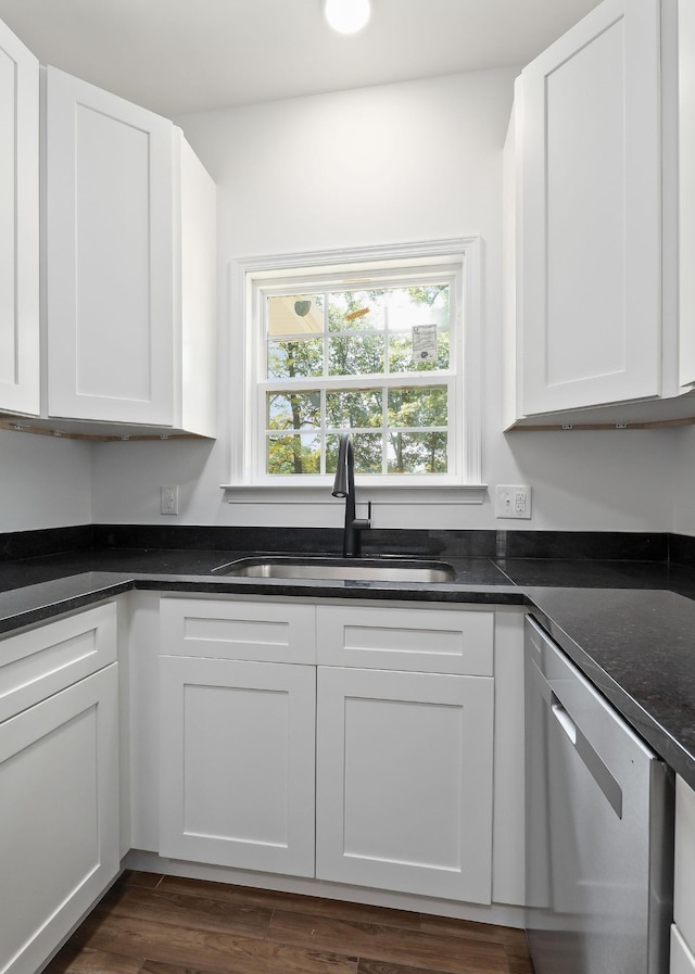795 Lowery Ln, Mcminnville, TN 37110 - kitchen with stainless steel dishwasher, a sink, white cabinets, and dark wood-style floors