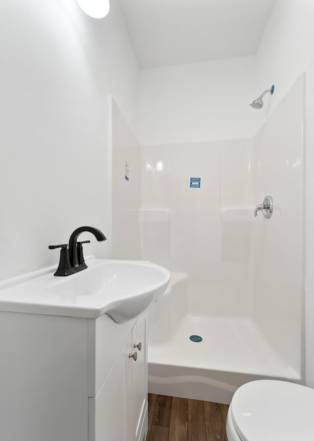 795 Lowery Ln, Mcminnville, TN 37110 - full bath featuring vanity, toilet, wood finished floors, and a shower
