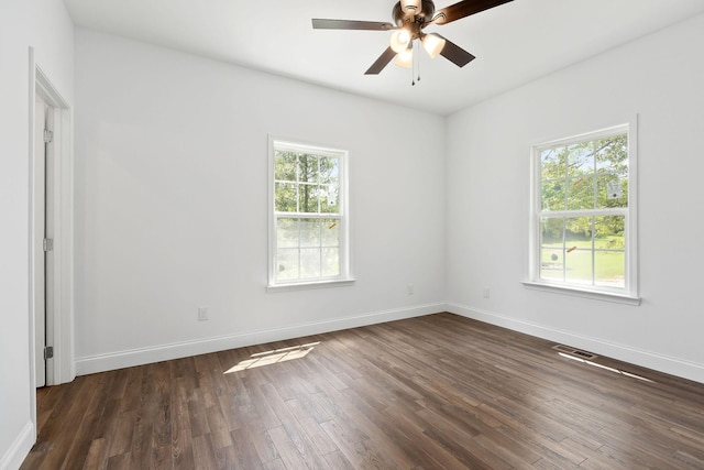 795 Lowery Ln, Mcminnville, TN 37110 - unfurnished room with dark wood-type flooring, a ceiling fan, baseboards, and visible vents