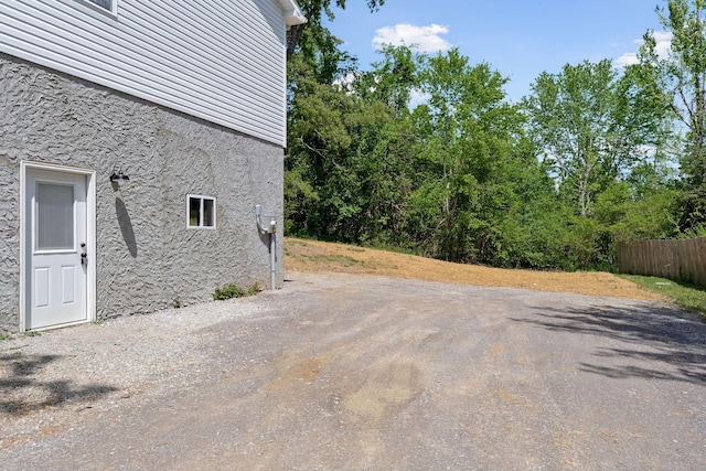 795 Lowery Ln, Mcminnville, TN 37110 - exterior space featuring stucco siding, stone siding, and fence