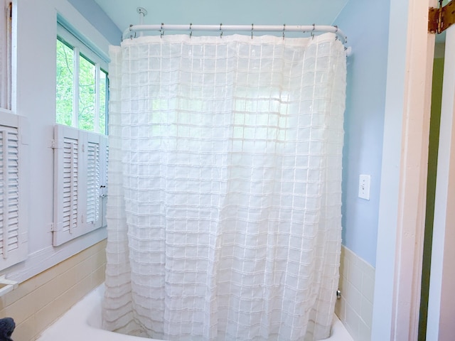 full bath with a shower with curtain