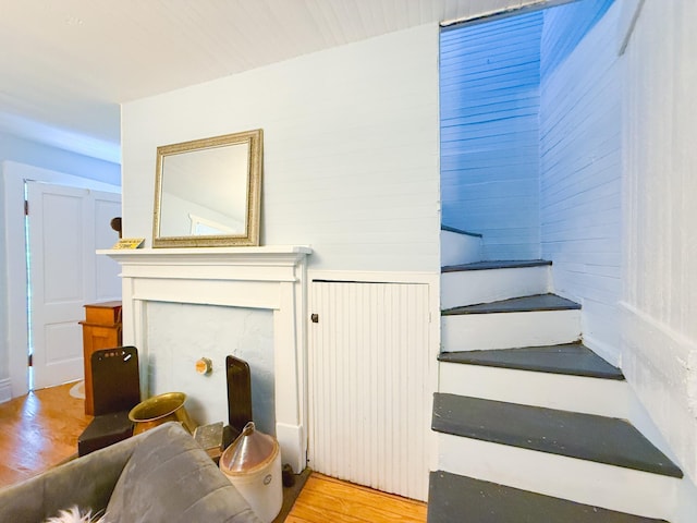 living area featuring stairs and light wood finished floors