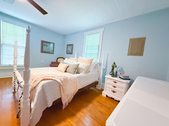 bedroom with ceiling fan and light wood-style flooring
