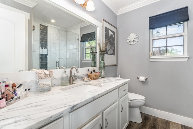 bathroom featuring ornamental molding, wood finished floors, toilet, baseboards, and a shower stall