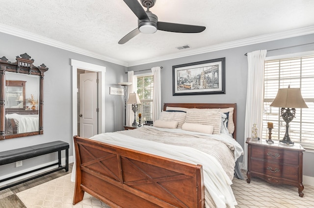 bedroom with crown molding, a textured ceiling, visible vents, and ceiling fan