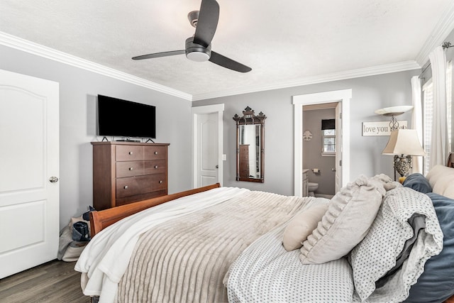 bedroom with crown molding, ceiling fan, wood finished floors, and ensuite bathroom
