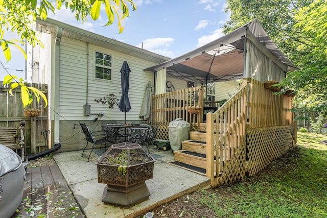 rear view of property with a patio area and a wooden deck
