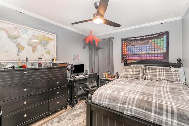 bedroom with crown molding, a ceiling fan, and wood finished floors