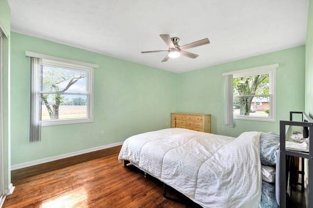 401 Longview St, Athens, AL 35611 - bedroom featuring baseboards, ceiling fan, and wood finished floors