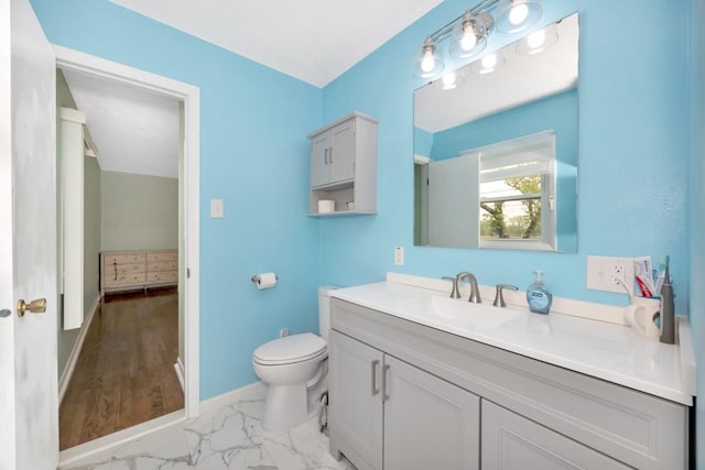 401 Longview St, Athens, AL 35611 - bathroom with toilet, baseboards, marble finish floor, and vanity