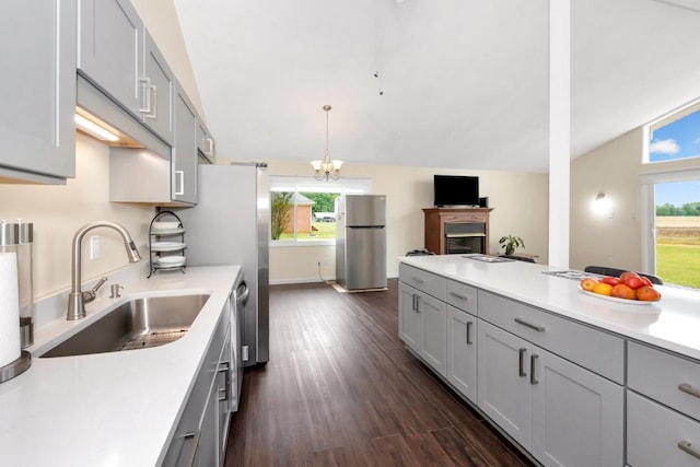 401 Longview St, Athens, AL 35611 - kitchen featuring a sink, gray cabinetry, freestanding refrigerator, and vaulted ceiling