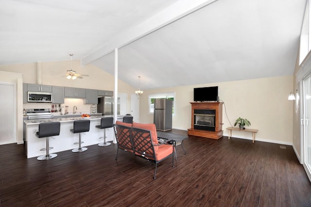 401 Longview St, Athens, AL 35611 - living room featuring dark wood-style flooring, a glass covered fireplace, beam ceiling, baseboards, and high vaulted ceiling